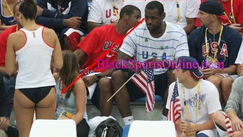 US basketball players Le Bron James (C-R) and Jason Kidd (R) wait for the start of the swimming at the National Aquatics Center during the 2008 Beijing Olympic Games on August 13, 2008 in Beijing. AFP PHOTO / GREG WOOD (Photo credit should read GREG WOOD/AFP/Getty Images)