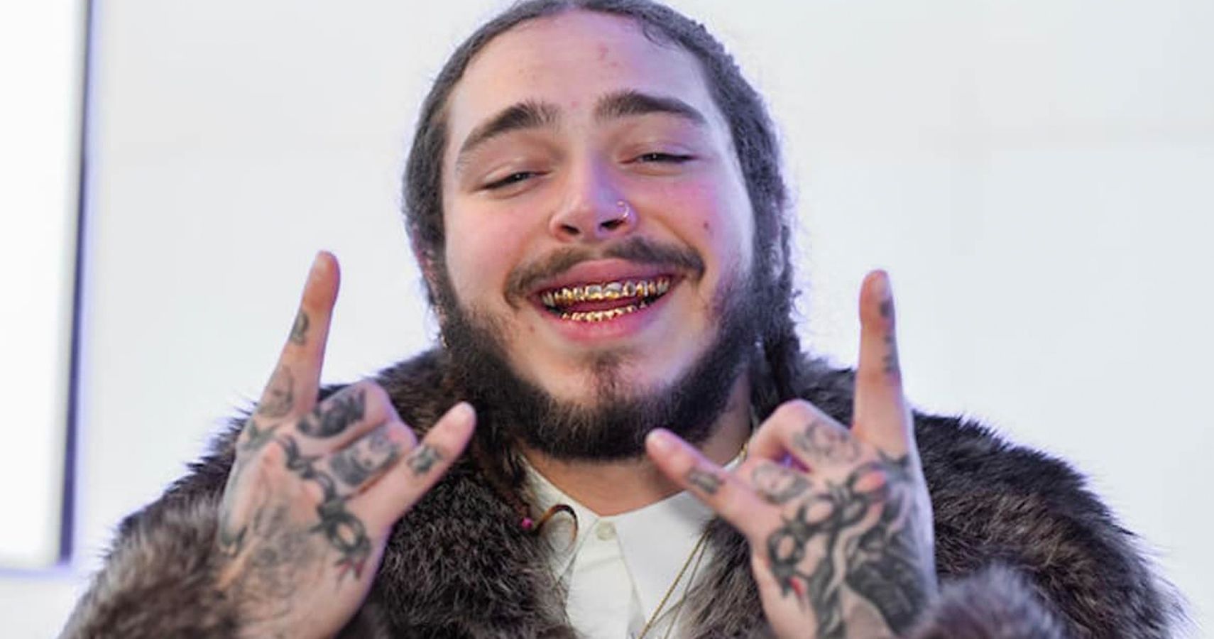 we-can-t-unsee-post-malone-s-mustache-looks-like-two-dogs-kissing