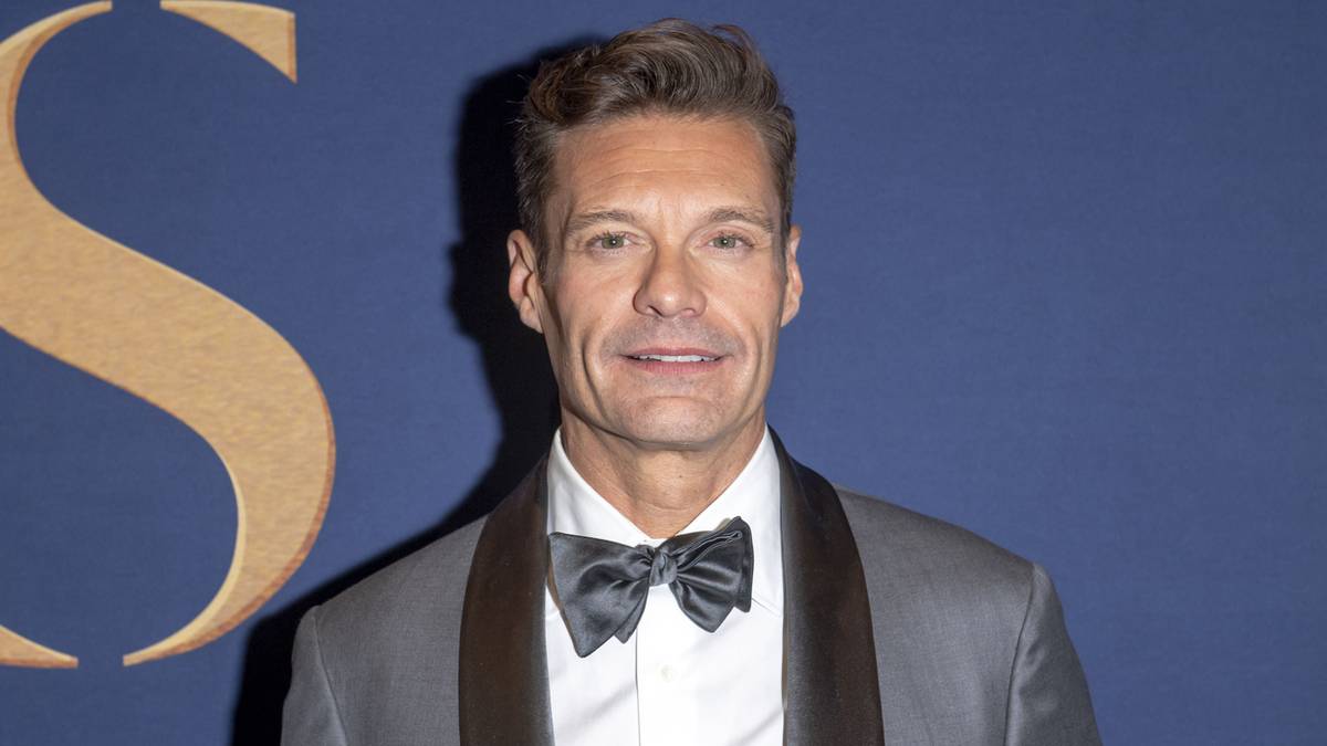 Ryan Seacrest hosting Wheel of Fortune